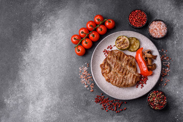 Grilled beef or pork steak, healthy restaurant food for lunch. Barbecue steak as a background