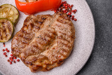 Grilled beef or pork steak, healthy restaurant food for lunch. Barbecue steak as a background