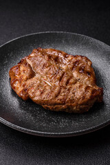 Grilled beef or pork steak, healthy restaurant food for lunch. Barbecue steak as a background