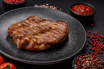 Grilled beef or pork steak, healthy restaurant food for lunch. Barbecue steak as a background