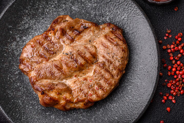 Grilled beef or pork steak, healthy restaurant food for lunch. Barbecue steak as a background