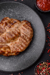 Grilled beef or pork steak, healthy restaurant food for lunch. Barbecue steak as a background