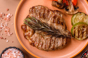 Grilled beef or pork steak, healthy restaurant food for lunch. Barbecue steak as a background