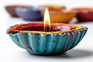 Colorful diya lamp burns brightly during cultural celebration in a festive setting with vibrant background