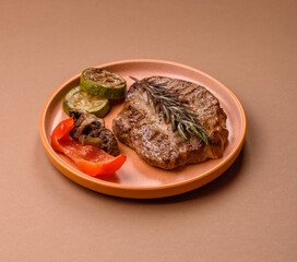 Grilled beef or pork steak, healthy restaurant food for lunch. Barbecue steak as a background