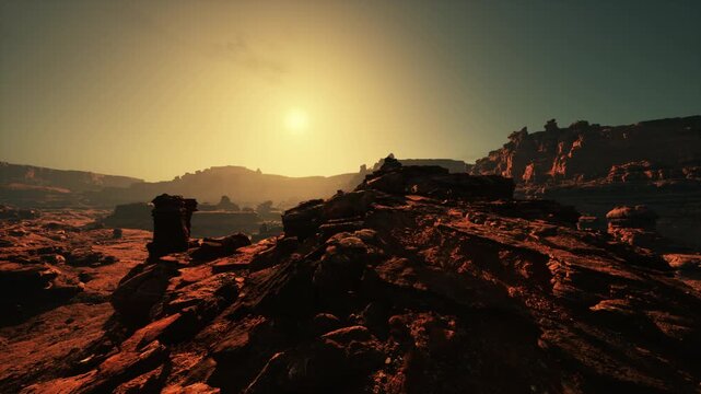 Witness the awe-inspiring sight of a courageous individual triumphantly standing atop the rocky pinnacle of the red stone canyon.