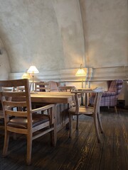 Cozy Vintage Café Interior with Wooden Furniture and Warm Lighting