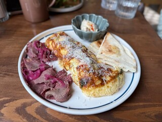 Gourmet Breakfast Plate with Omelette and Roast Beef