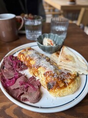 Gourmet Breakfast Plate with Omelette and Roast Beef