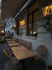 Naklejka premium Cozy Outdoor Café Terrace at Dusk