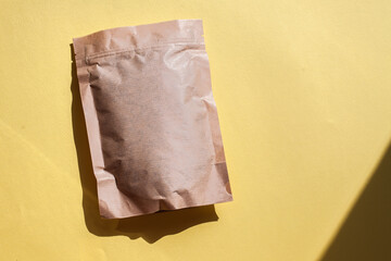 Blank craft plastic pouch, white pack on studio background with shadow, mylar bag isolated for coffee or food, cosmetic products, snack, candy. Different sizes, mock up.