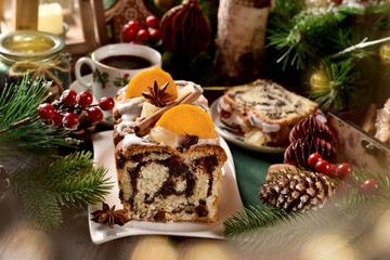 Homemade poppy seed cake and coffee on Christmas table