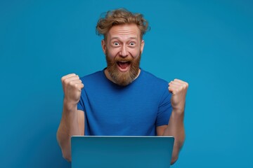 Overjoyed Man Celebrating Success with His Laptop