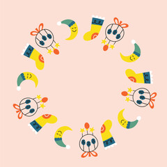 Cute Christmas wreath with crescent moon, sock and decorative toy isolated on pastel pink background. New year circle frame with boho icons.