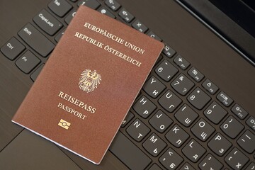 Austria Passport Lies Black Laptop