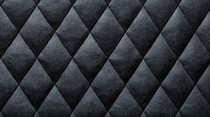 Obraz premium Black quilt with a diamond pattern. The quilt is made of a shiny material and has a shiny black color