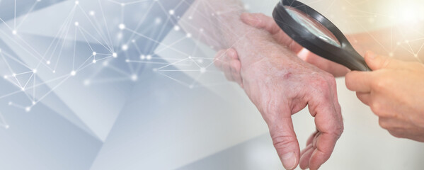 Dermatologist examining skin of patient hand; panoramic banner