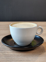 Brewed coffee in a porcelain cup. Hot coffee drink