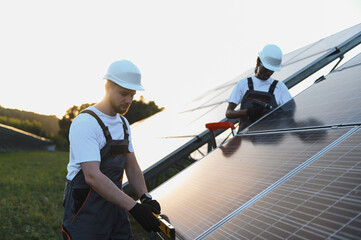 Installers working on solar panels, generating renewable energy