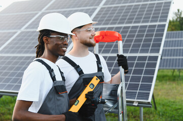 Solar panel technicians installing renewable energy system
