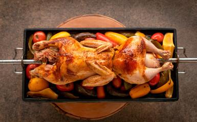 Naklejka premium Peruvian cuisine. Pollo a la brasa – chicken cooked on a spit. Top view