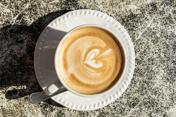 Cappuccino - eine Tasse Kaffee mit Milchschaum	
