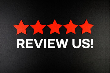 Review Us! text with five star on black background