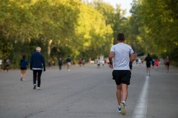 Fototapeta premium Back view of a jogger man running