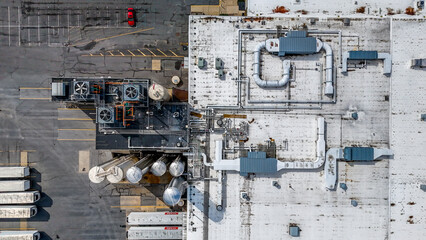 Aerial top down old industrial rooftop covered in compressed gas pipes in Appalachia Pennsylvania