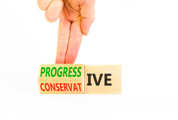 Progressive or conservative symbol. Businessman turns wooden cubes and changes word Conservative to Progressive. Beautiful white background. Business progressive or conservative concept. Copy space.