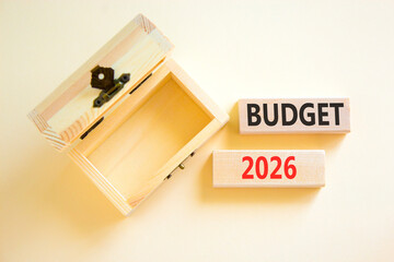 Budget 2026 symbol. Concept words Budget 2026 on beautiful wooden blocks. Beautiful white paper background. Beautiful empty wooden chest. Business and budget 2026 concept. Copy space.