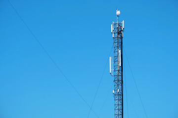 Maintenance staff at the work. High-altitude work. Worker repair cell tower