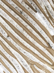 Frozen lake texture with snow and ice. Winter background.