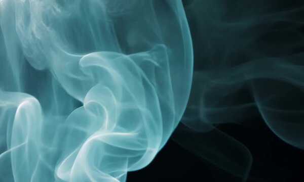 Ethereal swirling smoke effect on dark backdrop for visual effects