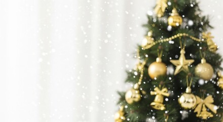 Festive blurred Christmas tree adorned with shiny golden ornaments and sparkling falling snow