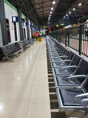 Empty Waiting Seats and Station Hall Interior