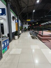 Empty Train Station Platform and Rail Tracks