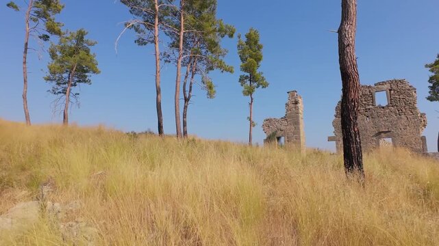  Aerial fpv drone footage flying through ancient doorways and windows of ruins in Seleukeia, Antalya, Turkey.