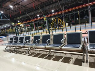 Empty Waiting Seats and Station Hall Interior