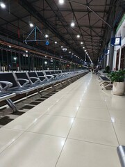 Empty Train Station Platform and Rail Tracks