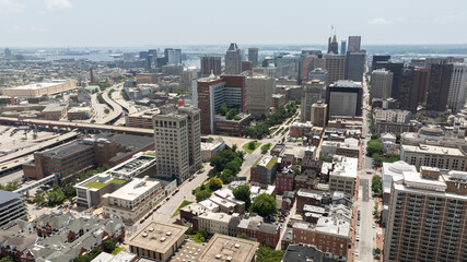 Morning sun shines on beautiful historic building architecture in the heart of the Mount Vernon neighborhood of Baltimore, Maryland, USA.