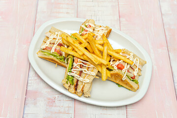 Classic mixed sandwich with cooked ham and melted Emmental cheese between two slices of toasted white bread