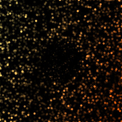 Abstract Golden Orange Glitter Sparkle Dust Particles Bokeh Effect on Black Background