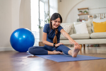 Young women wearing sportswear relax doing yoga workout trainer class at home, fitness and...