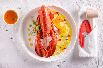 Teasty cooked lobster prepared in orange and butter sauce.