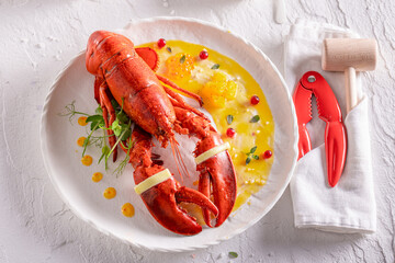 Exclusive cooked lobster prepared in orange and butter sauce.