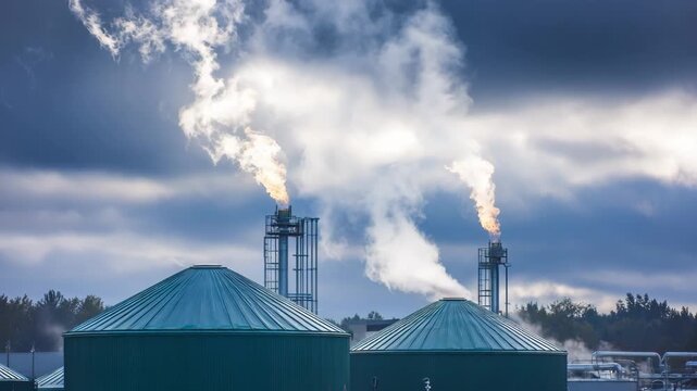 Medium shot of biogas combustion units fueled by captured methane near a waste processing plant illustrating efficient renewable energy generation from emissions.