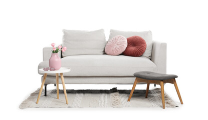 Soft sofa, bench and coffee table with tulips isolated on white