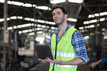Factory male worker. Engineer man worker working with labtop checking working in industrial manufacturing factory, men at work to checking equipment of machinery production technology or construction.