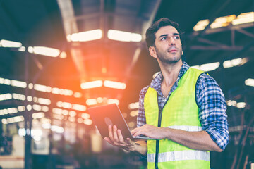 Factory male worker. Engineer man worker working with labtop checking working in industrial manufacturing factory, men at work to checking equipment of machinery production technology or construction.